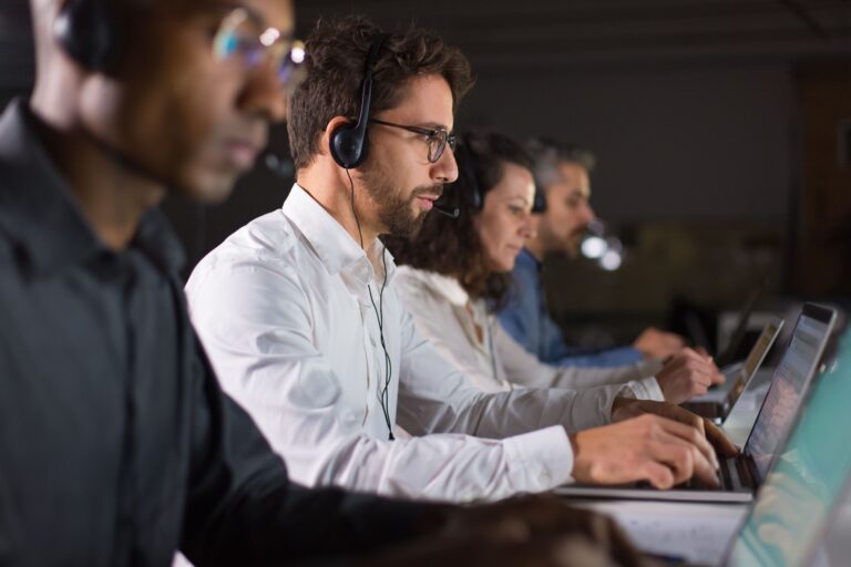 confident-call-center-operator-talking-with-client-min